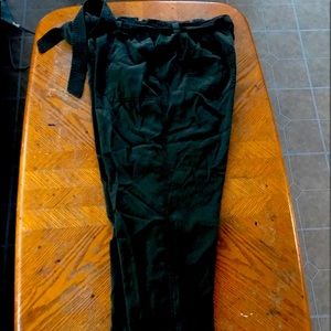 Women’s green slacks with tie belt
